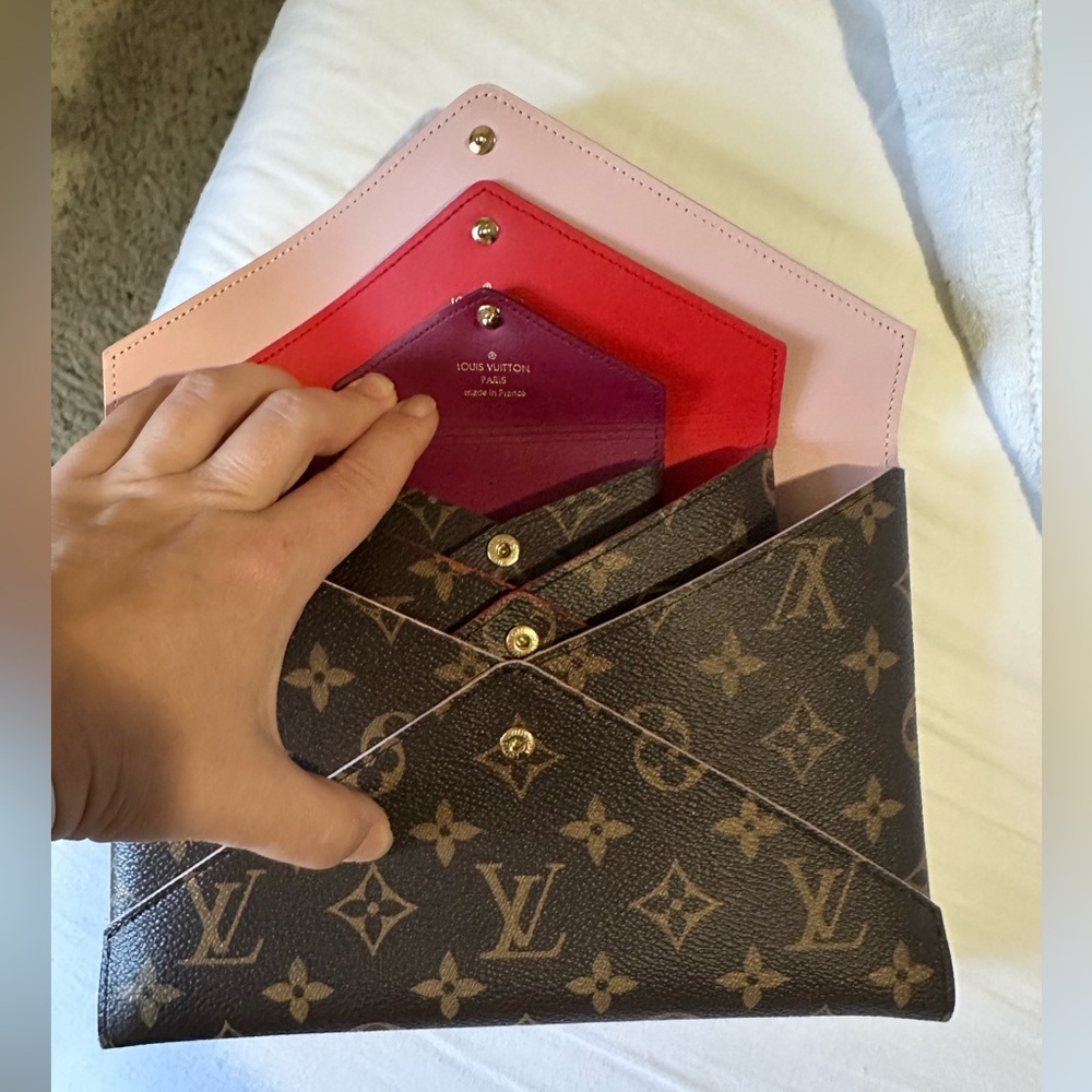 Louis Vuitton Kirigami Pochette. Great condition. No box. Receipt faded.